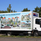 LKW Werbefläche mit Foliendruck. Anfertigung inkl. der 3D Computergrafik (Architekturdarstellung). Montage der Druckbahnen auf 7.5 Tonner (2-seitig).